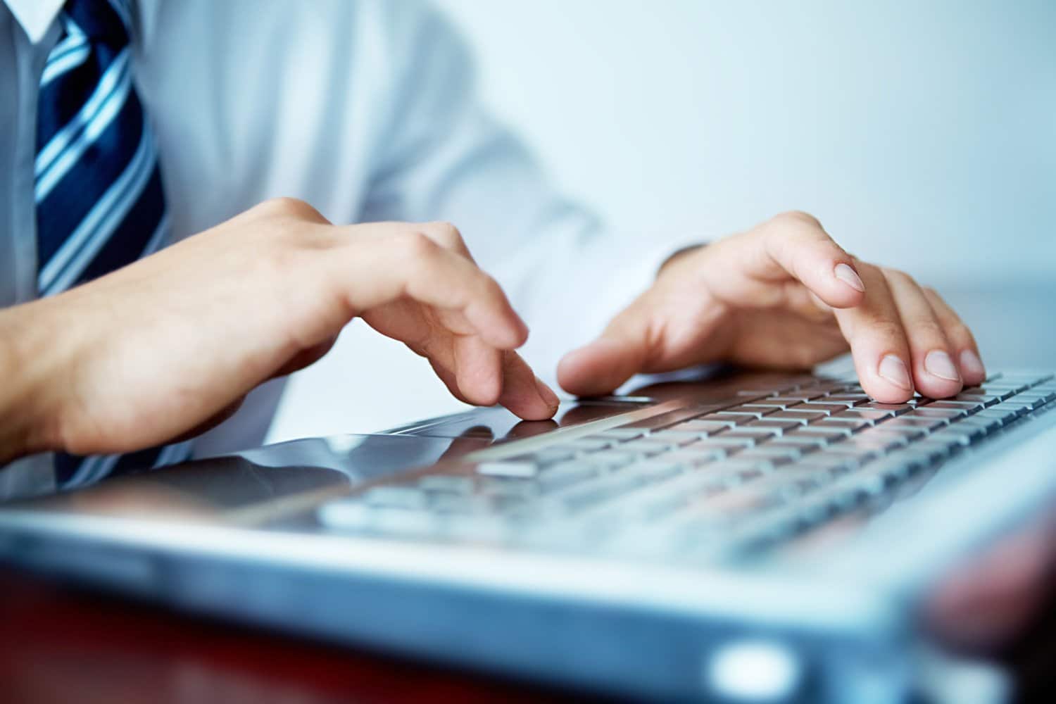 man typing on computer 1